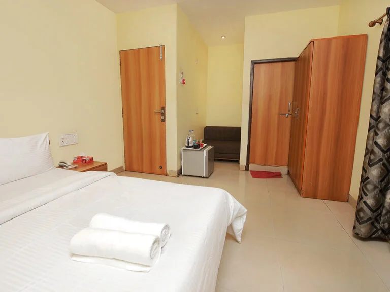 Deluxe Room at Westend Hotel Matheran with double bed and balcony